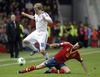 Teemu Pukki of Finland (L) and Sergio Busquets of Spain (R) during the FIFA World Cup Qualifier Match between Spain and Finland at the El Molinon Stadium, Gijon, Spain, on Friday, 22nd of March 2013.
