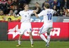 Teemu Pukki of Finland (R) celebrates his goal with his teammate Alexander Ring (L) during the FIFA World Cup Qualifier Match between Spain and Finland at the El Molinon Stadium, Gijon, Spain, on Friday, 22nd of March 2013.

