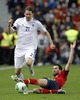 Kasper Hamalainen of Finland (L) and Sergio Busquets of Spain (R) during the FIFA World Cup Qualifier Match between Spain and Finland at the El Molinon Stadium, Gijon, Spain, on Friday, 22nd of March 2013.
