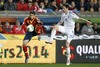 Jordi Alba of Spain (L) and Kasper Hamalainen of Finland (R) during the FIFA World Cup Qualifier Match between Spain and Finland at the El Molinon Stadium, Gijon, Spain, on Friday, 22nd of March 2013.
