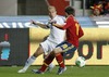 Jordi Alba of Spain (R) and Kari Arkivuo of Finland (L) during the FIFA World Cup Qualifier Match between Spain and Finland at the El Molinon Stadium, Gijon, Spain, on Friday, 22nd of March 2013.
