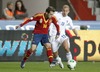 Jordi Alba of Spain (L) and Kari Arkivuo of Finland (R) during the FIFA World Cup Qualifier Match between Spain and Finland at the El Molinon Stadium, Gijon, Spain, on Friday, 22nd of March 2013.

