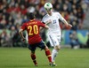 Jukka Raitala of Finland (R) and Santi Cazorla of Spain (L)  during the FIFA World Cup Qualifier Match between Spain and Finland at the El Molinon Stadium, Gijon, Spain, on Friday, 22nd of March 2013.
