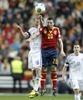 Teemu Tainio of Finland (R) and Santi Cazorla of Spain (L)  during the FIFA World Cup Qualifier Match between Spain and Finland at the El Molinon Stadium, Gijon, Spain, on Friday, 22nd of March 2013.
