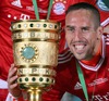 Franck Ribery of FC Bayern Muenchens celebrates victory with trophy after the DFB Pokal Final Match between FC Bayern Munich and VfB Stuttgart. DFB Pokal Final Match between FC Bayern Munich and VfB Stuttgart was held at the Olympiastadium in Berlin, Germany on Saturday, 1st of June 2013.
