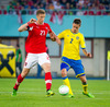 Marc Janko of Austria and Mikael Lustig of Sweden during FIFA World Cup Qualifier Match between Austria and Sweden. FIFA World Cup Qualifier Match between Austria and Sweden was played on Ernst Happel Stadium in Vienna, Austria, on Friday, 7th of June 2013.
