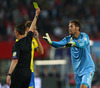 Goalie Andreas Isaksson of Sweden protests against his yellow card with referee Gianluca Rocchi during FIFA World Cup Qualifier Match between Austria and Sweden. FIFA World Cup Qualifier Match between Austria and Sweden was played on Ernst Happel Stadium in Vienna, Austria, on Friday, 7th of June 2013.

