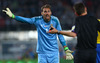 Goalie Andreas Isaksson of Sweden protests against his yellow card with referee Gianluca Rocchi during FIFA World Cup Qualifier Match between Austria and Sweden. FIFA World Cup Qualifier Match between Austria and Sweden was played on Ernst Happel Stadium in Vienna, Austria, on Friday, 7th of June 2013.
