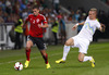 Andi Lila of Albania (L) and Jasmin Kurtic of Slovenia (R) during FIFA World cup 2014 qualification football match between Slovenia and Albania. Match between Slovenia and Albania was played in Stozice arena in Ljubljana, Slovenia, on Friday, 6th of September 2013.

