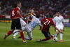 Odise Roshi of Albania (M) shooting on goal between Bojan Jokic of Slovenia (L) and Branko Ilic of Slovenia (R) during FIFA World cup 2014 qualification football match between Slovenia and Albania. Match between Slovenia and Albania was played in Stozice arena in Ljubljana, Slovenia, on Friday, 6th of September 2013.
