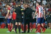 Atletico de Madrid coach Diego Pablo Cholo Simeone have words with the referee Bjorn Kuipers in presence of his players during the UEFA Champions League Final Match between Real Madrid and Atletico Madrid at the Estadio da Luz in Lissabon, Portugal on 2014/05/24.
