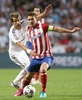 Real Madrid Fabio Coentrao (l) and Atletico de Madrid Gabi Fernandez during the UEFA Champions League Final Match between Real Madrid and Atletico Madrid at the Estadio da Luz in Lissabon, Portugal on 2014/05/24.
