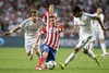 Real Madrid Fabio Coentrao (l) and Sami Khedira (r) and Atletico de Madrid Gabi Fernandez during the UEFA Champions League Final Match between Real Madrid and Atletico Madrid at the Estadio da Luz in Lissabon, Portugal on 2014/05/24.
