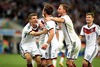 Mario Goetze (GER) celebrates his goal with Thomas Mueller (GER) and other teammates during Final match between Germany and Argentina of the FIFA Worldcup Brazil 2014 at the Maracana in Rio de Janeiro, Brazil on 2014/07/13. 
