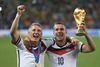 Bastian Schweinsteiger (GER) and Lukas Podolski (GER) celebrate with World Cup trophy Final match between Germany and Argentina of the FIFA Worldcup Brazil 2014 at the Maracana in Rio de Janeiro, Brazil on 2014/07/13. 

