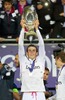 Real Madrids Gareth Bale lifts the trophy after his side 2-0 victory over Sevilla during the UEFA Supercup Match between Real Madrid and FC Sevilla at the Millenium Stadium in Cardiff, Cardiff on 2014/08/12.
