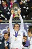 Real Madrids Gareth Bale lifts the trophy after his side 2-0 victory over Sevilla during the UEFA Supercup Match between Real Madrid and FC Sevilla at the Millenium Stadium in Cardiff, Cardiff on 2014/08/12.
