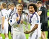 Real Madrids Luka Modric and Marcelo celebrate with the trophy after their 2-0 victory over Sevilla during the UEFA Supercup Match between Real Madrid and FC Sevilla at the Millenium Stadium in Cardiff, Cardiff on 2014/08/12.
