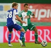 Rasmus Schueller (HJK Helsinki) and Steffen Hofmann, (SK Rapid Wien) during a UEFA Europa League between SK Rapid Vienna and HJK Helsinki at the Ernst Happel Stadion, Wien, Austria on 2014/08/28.
