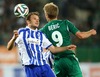 Markus Heikkinen (HJK Helsinki) and Roman Beric (SK Rapid Wien) during a UEFA Europa League between SK Rapid Vienna and HJK Helsinki at the Ernst Happel Stadion, Wien, Austria on 2014/08/28.
