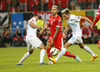 Valon Behrami of Switzerland (M) between Andraz Kirm of Slovenia (L) and Kevin Kampl of Slovenia (R) during UEFA European qualifiers football match between Slovenia and Switzerland. Match between Slovenia and Switzerland was played in arena Ljudski vrt in Maribor, Slovenia, on Thursday, 9th of October 2014.
