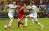 Stephan Lichtsteiner of Switzerland (M) between Andraz Struna of Slovenia (L) and Kevin Kampl of Slovenia (R) during UEFA European qualifiers football match between Slovenia and Switzerland. Match between Slovenia and Switzerland was played in arena Ljudski vrt in Maribor, Slovenia, on Thursday, 9th of October 2014.
