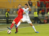 Stephan Lichtsteiner of Switzerland (L) and Andraz Kirm of Slovenia (R) during UEFA European qualifiers football match between Slovenia and Switzerland. Match between Slovenia and Switzerland was played in arena Ljudski vrt in Maribor, Slovenia, on Thursday, 9th of October 2014.
