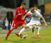 Haris Seferovic of Switzerland (L) and Zeljko Filipovic of Slovenia (R) during UEFA European qualifiers football match between Slovenia and Switzerland. Match between Slovenia and Switzerland was played in arena Ljudski vrt in Maribor, Slovenia, on Thursday, 9th of October 2014.
