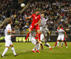 Josip Drmic of Switzerland trying to score, while goalie Samir Handanovic of Slovenia successfully defends his goal during UEFA European qualifiers football match between Slovenia and Switzerland. Match between Slovenia and Switzerland was played in arena Ljudski vrt in Maribor, Slovenia, on Thursday, 9th of October 2014.
