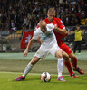 Miso Brecko of Slovenia (L) and Pajtim Kasami of Switzerland (R) during UEFA European qualifiers football match between Slovenia and Switzerland. Match between Slovenia and Switzerland was played in arena Ljudski vrt in Maribor, Slovenia, on Thursday, 9th of October 2014.
