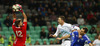 Goalie Elia Benedettini of San Marino (L) in action against Milivoje Novakovic of Slovenia (M) during UEFA European qualifiers football match between Slovenia and San Marino. UEFA European qualifiers atch between Slovenia and San Marino was played in Stozice arena in Ljubljana, Slovenia, on Friday, 27th of March 2015.
