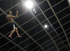 Spectator climbing on roped fence during UEFA European qualifiers football match between Slovenia and England. UEFA European qualifiers match between Slovenia and England was played in Stozice arena in Ljubljana, Slovenia, on Sunday, 14th of June 2015.
