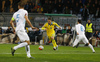 Yevhen Konoplyanka of Ukraine (M) between Bostjan Cesar of Slovenia (L) and Branko Ilic of Slovenia (R) during UEFA European qualifiers play-off football match between Slovenia and Ukraine. UEFA European qualifiers play-off match between Slovenia and Ukraine was played in Ljudski vrt arena in Maribor, Slovenia, on Tuesday, 17th of November 2015.
