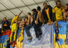 Ukrainian player celebrating qualification to Euro 2016 with Ukrainian fans after end of the UEFA European qualifiers play-off football match between Slovenia and Ukraine. UEFA European qualifiers play-off match between Slovenia and Ukraine was played in Ljudski vrt arena in Maribor, Slovenia, on Tuesday, 17th of November 2015.
