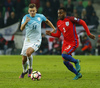 Roman Bezjak (no.14) of Slovenia (L) and Danny Rose (no.3) of England during football match of FIFA World cup qualifiers between Slovenia and England. FIFA World cup qualifiers between Slovenia and England was played on Tuesday, 11th of October 2016 in Stozice arena in Ljubljana, Slovenia.
