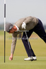 Mikko Ilonen of Finland repairs a divot while competing at The Old Course during the final round of the Alfred Dunhill Links Champions, part of the PGA European Tour, Race to Dubai Championship.
