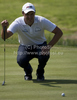 Simon Kahn lines up a putt on day one of the Celtic Manor Wales Open 2010, in the Celtic Manor Resort and Golf Club, part of the Race to Dubai tournament.
