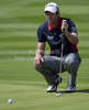 Bradley Dredge (GBR) lines up a putt on day one of the Celtic Manor Wales Open 2010, in the Celtic Manor Resort and Golf Club, part of the Race to Dubai tournament.
