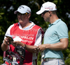 Niclas Fasth (SWE) and his caddie Gerry Byrne discuss yardage on day one of the Celtic Manor Wales Open 2010, in the Celtic Manor Resort and Golf Club, part of the Race to Dubai tournament.
