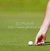 A golfer marks his position on a green during the first day of the European Tour, 14th Open de Saint-Omer, part of the Race to Dubai tournament and played at the AA Saint-Omer Golf Club .
