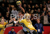 Ivana Lovric (no.8) of Metz Handball (M) between Spela Cerar (no.3) of RK Krim (R) and Tamara Mavsar (no.8) of RK Krim (L) during second round match of Women Champions league between RK Krim, Ljubljana, Slovenia, and Metz Handball, Metz, France. Match between RK Krim and Metz Handball was played on 9th of November 2008 in Kodeljevo Arena in Ljubljana, Slovenia. Match ended with victory of Metz, who defeated RK Krim with 26:31.

