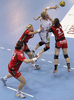 Mette Ommundsen (no.3) of HC Leipzig (M) between Alja Jankovic (no.21) of Krim Mercator (R) and Maja Zrnec (no.44) of Krim Mercator (L) during match of EHF Women Handball Champions League between RK Krim Mercator and HC Leipzig. Match of EHF Women Champions League between RK Krim Mercator, Ljubljana, Slovenia and HC Leipzig, Germany, was played in Kodeljevo Arena, Ljubljana, Slovenia, on Saturday, 13th of February 2010. Match was won by RK Krim Mercator, who defeated HC Leipzig with 32-26.

