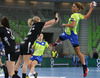 Andrea Penezic (no.23) of RK Krim Mercator (R) shooting over Saskia Lang (no.18) of HC Leipzig (L) during match of EHF Women handball Champions League between RK Krim Mercator, Slovenia, and HC Leipzig, Germany. Match of EHF Women handball Champions League between RK Krim Mercator and HC Leipzig was played on Saturday, 16th of November 2013 in Stozice arena in Ljubljana, Slovenia.
