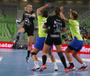 Saskia Lang (no.18) of HC Leipzig (L) shooting on goal over Oana Andreea Manea (no.77) of RK Krim Mercator (R) during match of EHF Women handball Champions League between RK Krim Mercator, Slovenia, and HC Leipzig, Germany. Match of EHF Women handball Champions League between RK Krim Mercator and HC Leipzig was played on Saturday, 16th of November 2013 in Stozice arena in Ljubljana, Slovenia.
