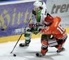 Miha Verlic (no 91) of HDD Tilia Olimpija  and Marjan Manfreda (no 18) of HK Acroni Jesenice during ice hockey match of Slovenian league finals 2011-2012 between HK Acroni Jesenice and HDD Tilia Olimpija. Match between HK Acroni Jesenice and HDD Tilia Olimpija was held on Monday, 2nd of April 2012 in Jesenice, Slovenia. 
