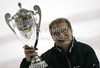 Coach of HDD Tilia Olimpija, Hannu Jarvenpaa celebrating Slovenia Ice hockey National championships trophy after ice hockey match of Slovenian league finals 2011-2012 between HK Acroni Jesenice and HDD Tilia Olimpija. Match between HK Acroni Jesenice and HDD Tilia Olimpija was held on Monday, 2nd of April 2012 in Jesenice, Slovenia. 

