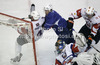 Andrej Tavzelj (4) of Slovenia and goalkeeper Robert Kristan of France during the match of EICH Ice hockey tournament between Slovenia and France. Match between Slovenia and France  was held in Tivoli Arena in Ljubljana, Slovenia, on Friday, 9th of November 2012. during match of EIHC ice hockey tournament between Slovenia and France. Match between Slovenia and France was played in Tivoli Arena in Ljubljana, Sloveni, on Friday, 9th of November 2012. Match was won by Slovenia, who defeated France with 3-1.
