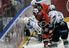 Marcel Rodman (no.22) of HK Acroni Jesenice (M) and David Rodman (no.12) of HK Acroni Jesenice (R)in fight for puck next to wall with Andrej Tavzelj (no.44) of HDD Tilia Olimpija (L) during match of Erste Bank Eishockey Liga 2008-09 between HK Acroni Jesenice, Jesenice, Slovenia and HDD Tilia Olimpija, Ljubjana, Slovenia. HK Acroni Jesenice won match and defeated HDD Tilia Olimpija 8:2. Match of EBEL League was played in Podmezaklja arena in Jesenice, Slovenia on 12th of October 2008.
