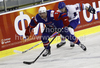 Jan Mursak (no.13) of Slovenia (L) ad Mark Garside (no.15) of Great Britain (R) during ice hockey match of IIHF Ice hockey World championships Division I, group B between Great Britain and Slovenia. Match between Great Britain and Slovenia of IIHF Ice hockey World championships Division I, group B was held on Tuesday, 20th of April 2010 in Ljubljana, Slovenia.
