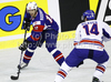 David Rodman (no.12) of Slovenia (L) and Jonathan Weaver (no.14) of Great Britain (R) during ice hockey match of IIHF Ice hockey World championships Division I, group B between Great Britain and Slovenia. Match between Great Britain and Slovenia of IIHF Ice hockey World championships Division I, group B was held on Tuesday, 20th of April 2010 in Ljubljana, Slovenia.
